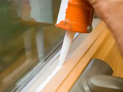 Professional weatherproof caulking around doors and windows